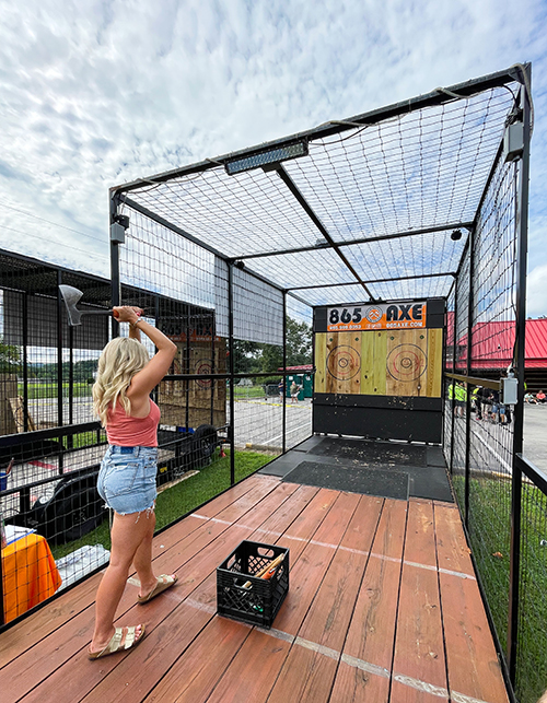 young lady throwing axes
