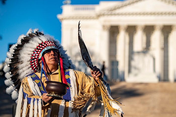 crow nation chief performs ceremy at tomb of unknown soldier