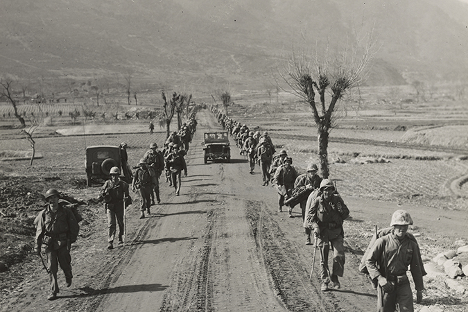 marines advance along roadside in central korea