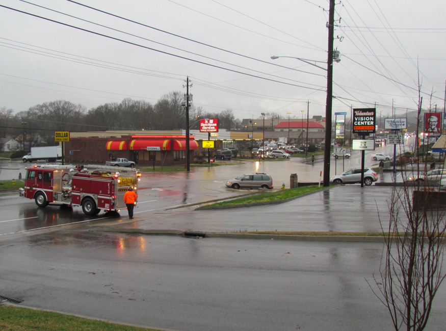 van driving into flooded streets