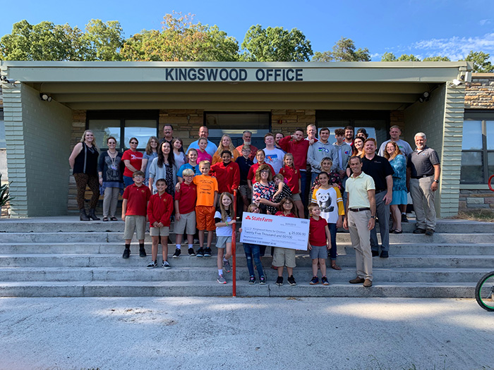 state farm presents check to kingswood home for children