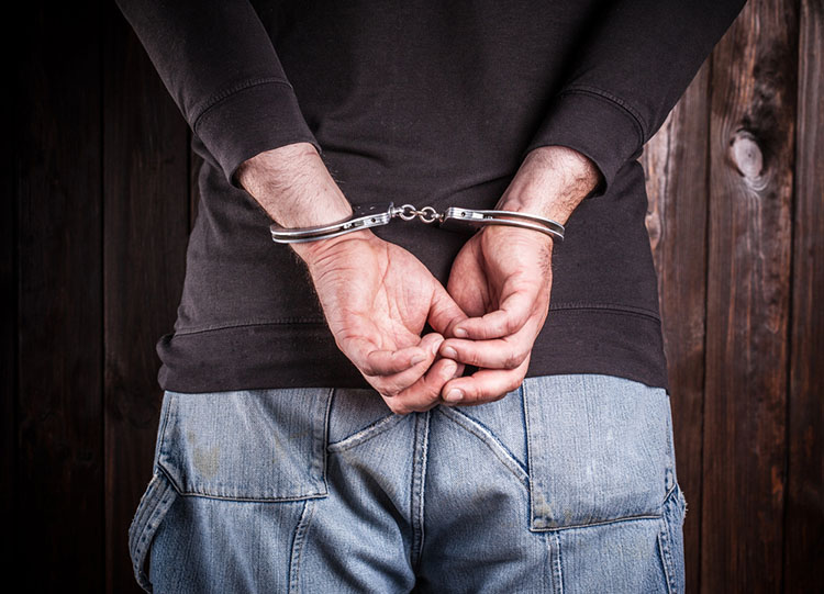 handcuffed man