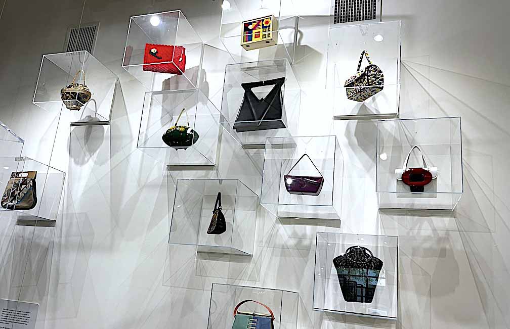 purses in acrylic cases