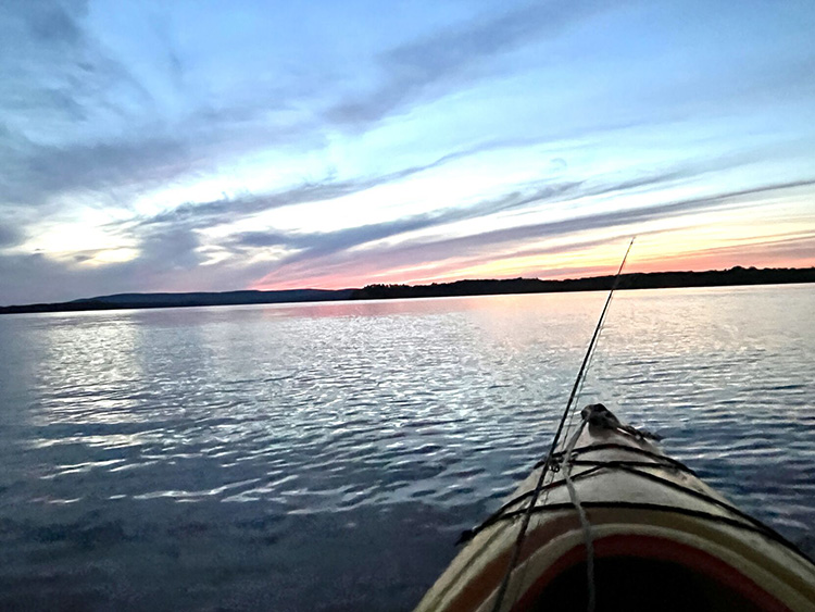 kayakers sunset